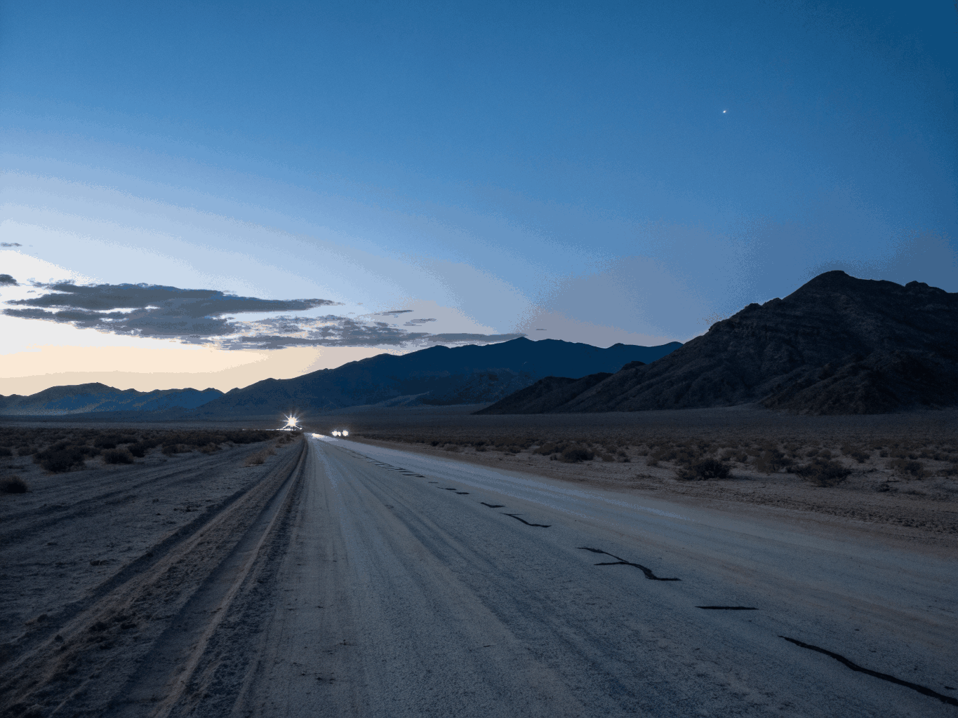 Cracked Route 66 asphalt extending toward a cosmic horizon with glowing neon green heat shimmer.